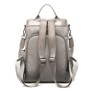 Chic khaki nylon anti-theft backpack for women with adjustable straps on white background