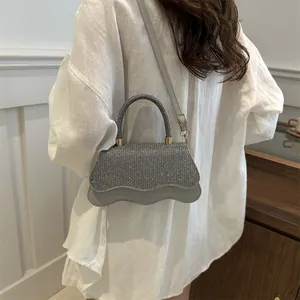 Silver rhinestone small square handbag with wavy edge and leather crossbody strap