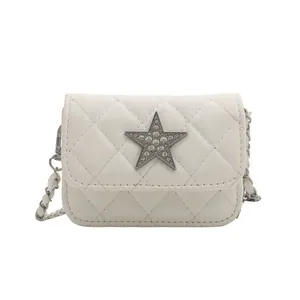 Stylish white quilted crossbody bag with rhinestone star detail and silver chain strap