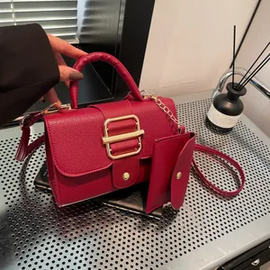 Dark red lychee pattern handbag with gold buckle and matching small coin purse