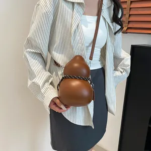 Unique brown gourd-shaped crossbody bag made of smooth PU leather for women