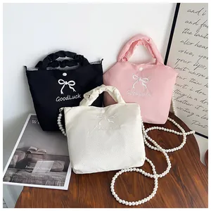 Bow embroidery handbag set in black, pink, and white with elegant pearl chain straps