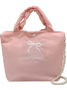 Pink waffle texture handbag with bow embroidery, pearl chain and GoodLuck text
