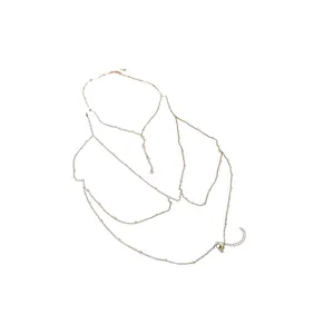Elegant layered gold body chain with shimmering beads and adjustable lobster clasp