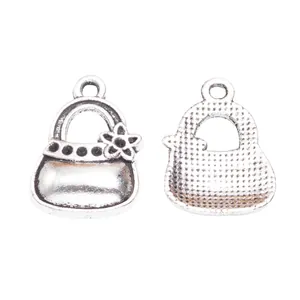 Vintage silver alloy handbag charms for DIY crafts and keychains with flower detail