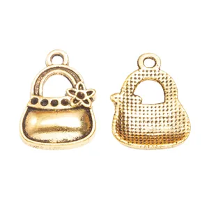 Vintage gold alloy handbag charm with floral accent and textured mesh back for DIY decor