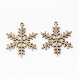 Ciondoli a fiocco di neve in metallo bronzo vintage per creazione di gioielli fai-da-te
