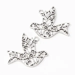 Vintage silver bird pendant charms with intricate filigree pattern for DIY jewelry making