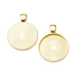 Detail of gold round pendant trays with textured base for DIY jewelry making