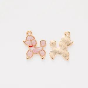 Detail of poodle charms with pink marble enamel finish and textured gold-plated back