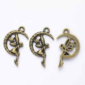 Macro view of antique bronze moon and fairy charms for DIY jewelry making and crafts