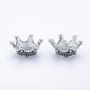 Vintage silver alloy crown charms with intricate beaded base detail for DIY jewelry