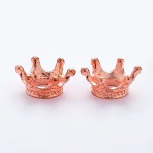 Detail of rose gold vintage crown charms for DIY jewelry making and bracelet beads