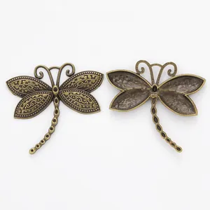Vintage bronze dragonfly charms with intricate carved details for DIY jewelry making