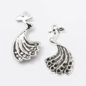 Pair of vintage zinc alloy peacock charms with detailed feather texture for DIY jewelry