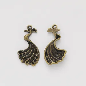 Pair of vintage peacock charms in bronze-finished alloy for DIY jewelry making