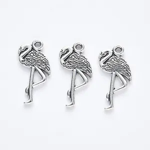 Three vintage silver flamingo alloy pendants for DIY jewelry making with feather details