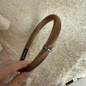Elegant coffee brown satin headband with luxury rhinestone embellishments and padding
