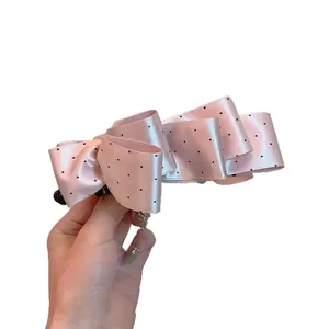 Pince à cheveux banane en satin rose à pois avec nœud papillon pour queue de cheval