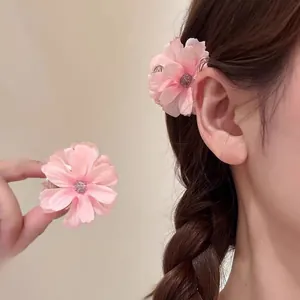 Elegant pink floral hair clip with silk petals and silver accents for women's hair styling