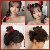 Close-up of red and black satin plaid scrunchies on ponytail and bun hairstyles
