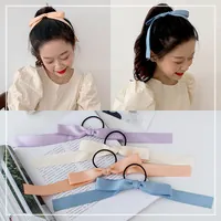 Detail view of multi-color ribbon bow hair ties with high-elastic black rubber bands