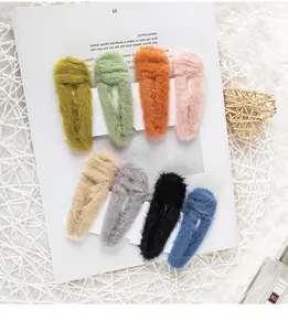 Detailed view of eight assorted faux rabbit fur hair clips in vibrant plush textures