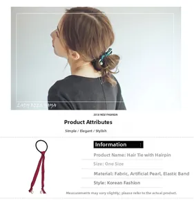 Detail eines koreanischen Haargummis mit grünem Stoffband und eleganten Kunstperlen
