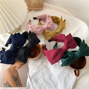 Set of six large satin bow headbands in various colors for women's hair styling
