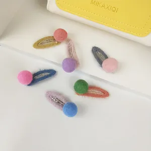 Detailed set of six colorful mohair wool felt BB clips with cute decorative pom-poms
