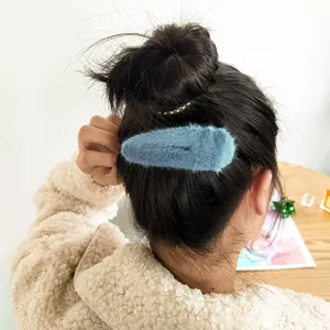 Blue faux fur barrette hair clip for women with soft plush texture for winter hairstyles