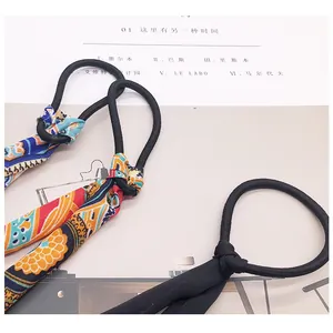 Detail of high-elasticity hair scrunchies set with floral print chiffon ribbons