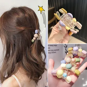 Detailed view of large macaron beaded hair claw clip with colorful resin beads