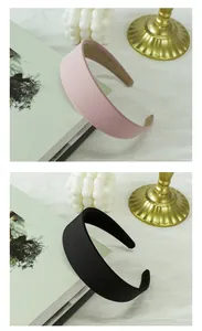 Detailed view of padded fabric headbands in black and pink with anti-slip inner lining
