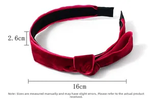 Detail view of burgundy velvet headband showing 2.6cm width and 16cm length dimensions