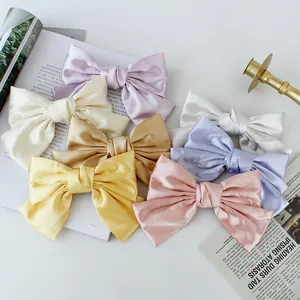 Elegant satin bow hair clip set in seven pastel colors for a stylish aesthetic look