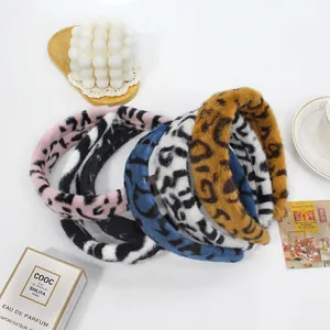 Flat lay of plush leopard print headbands in candy colors and soft faux fur material