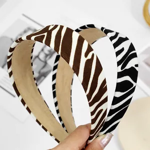 Detail of wide zebra print fabric headband with non-slip velvet inner lining texture