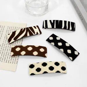 Set of 5 fabric leopard and polka dot hair clips with classic vintage aesthetic