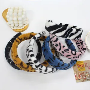 Plush animal print headbands in leopard and zebra patterns with soft faux fur texture