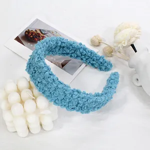 Detail of blue faux shearling headband with plush teddy fleece texture and thick design