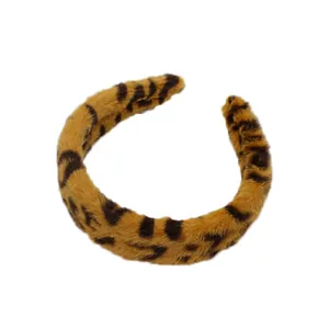Plush leopard print headband in brown and black faux fur for winter hair styling