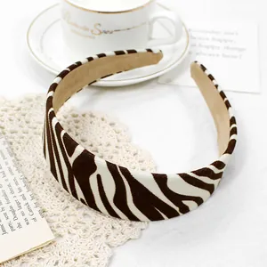 Detail of zebra print wide headband featuring retro animal pattern on soft fabric