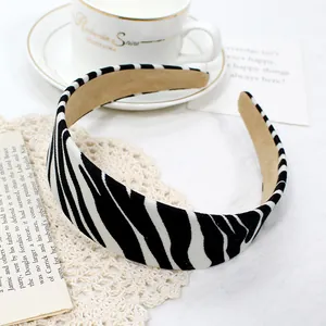 Detail view of zebra print wide headband with anti-slip beige suede lining texture