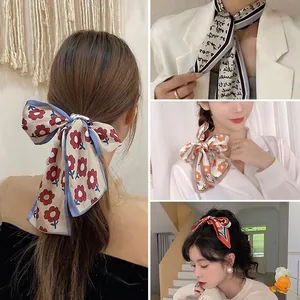 Detail view of colorful satin ribbon scarves showing diverse patterns and styling options