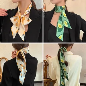 French vintage style silk scarf shown as a neck tie and ponytail hair ribbon accessory