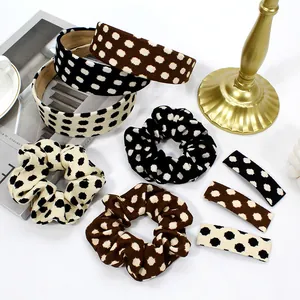 Polka dot hair accessory set with headbands, scrunchies and clips on white background