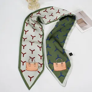 Detail of French bow silk scarf featuring geometric star patterns and handbag illustration