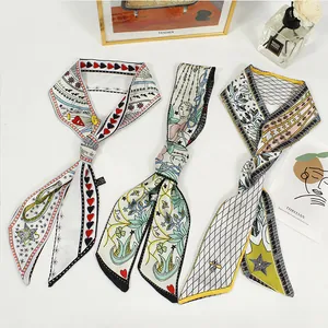 Detailed view of French vintage silk scarves with artistic tarot and floral patterns