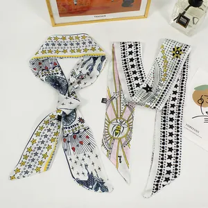 Macro view of French retro silk scarf hairbands with bee and star print patterns